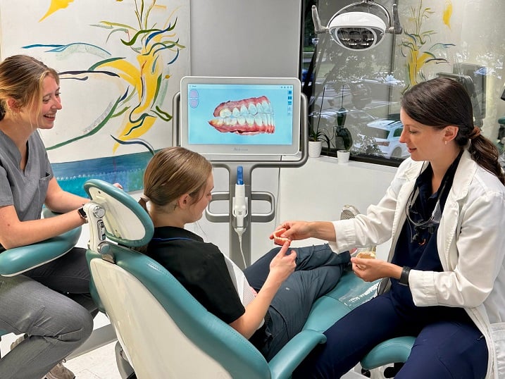 Dr. Clara Bergeron Prosthodontist, DDS, MS discussing Full Mouth Rehabilitation treatment with patient at Advanced Dentistry of Richmond's Virginia practice